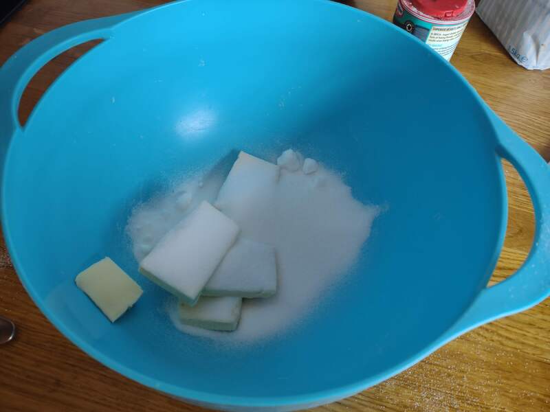 Butter and sugar in mixing bowl