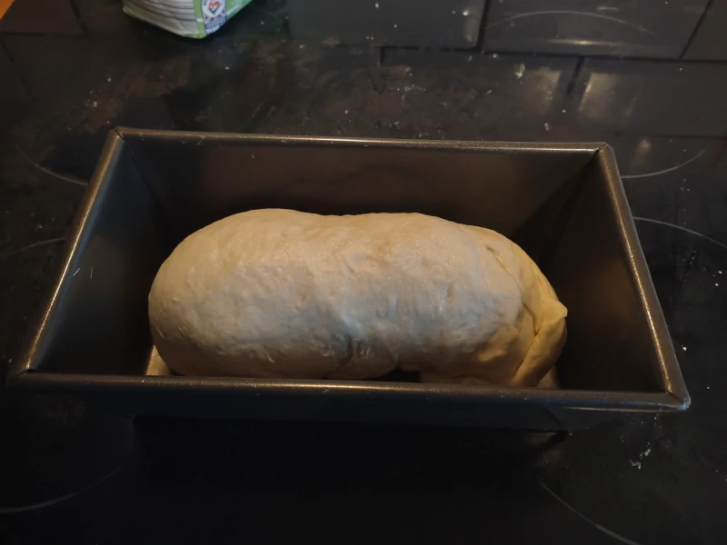 Shaped dough in bread tin