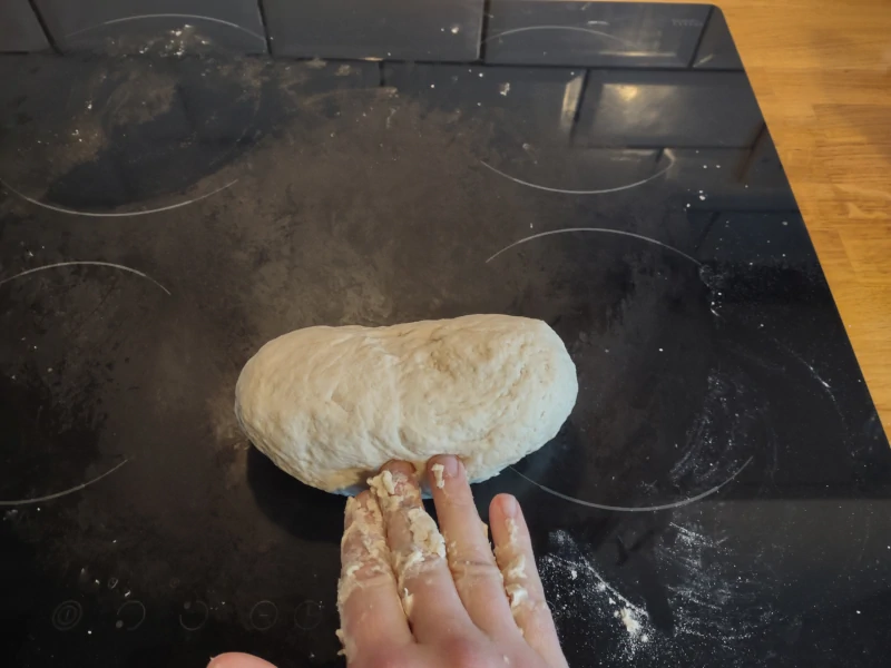 Roll back kneaded dough