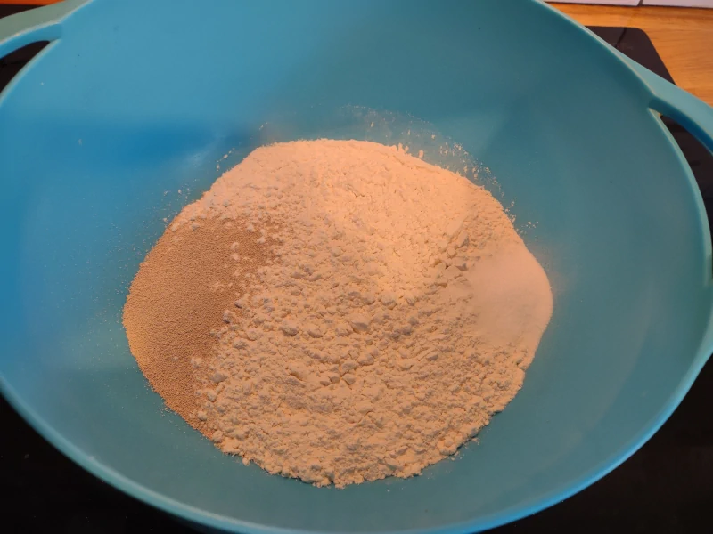 Salt and yeast added to the bowl