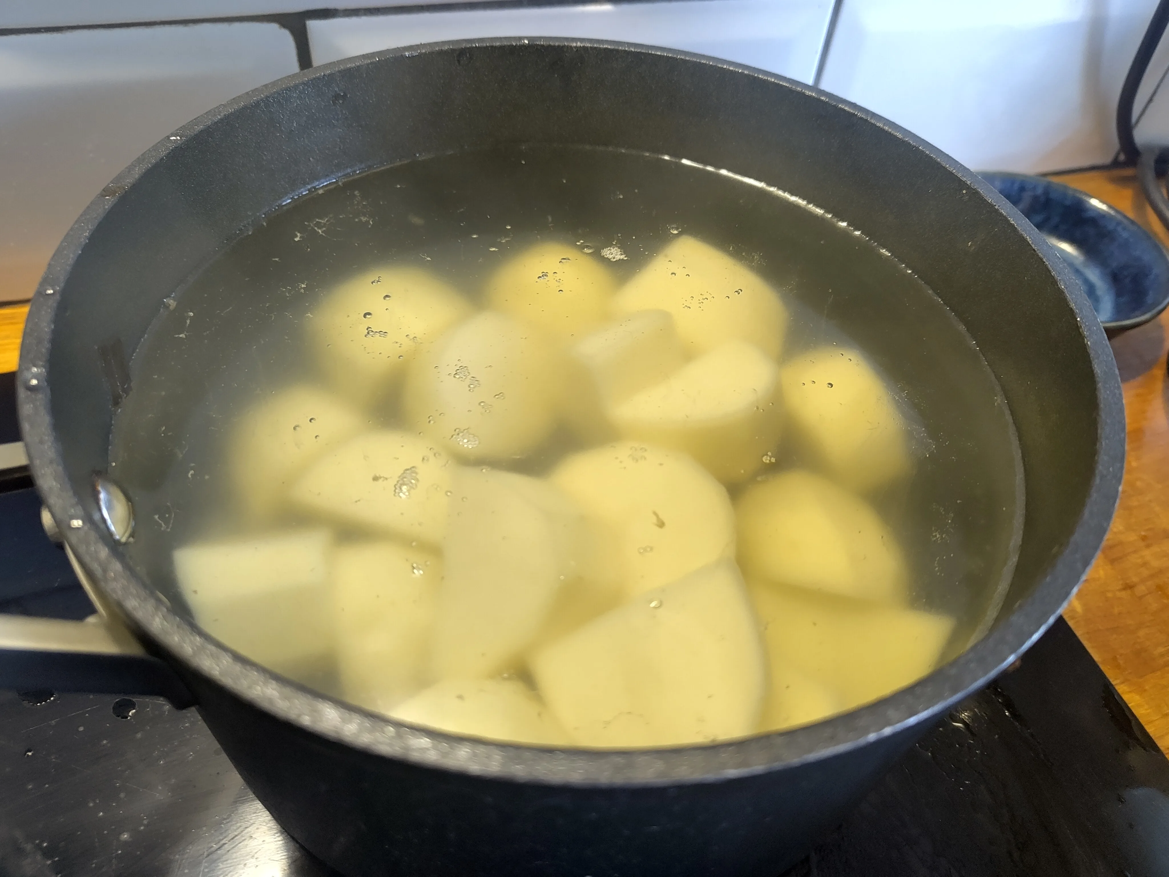 Potatoes boiling on the hob