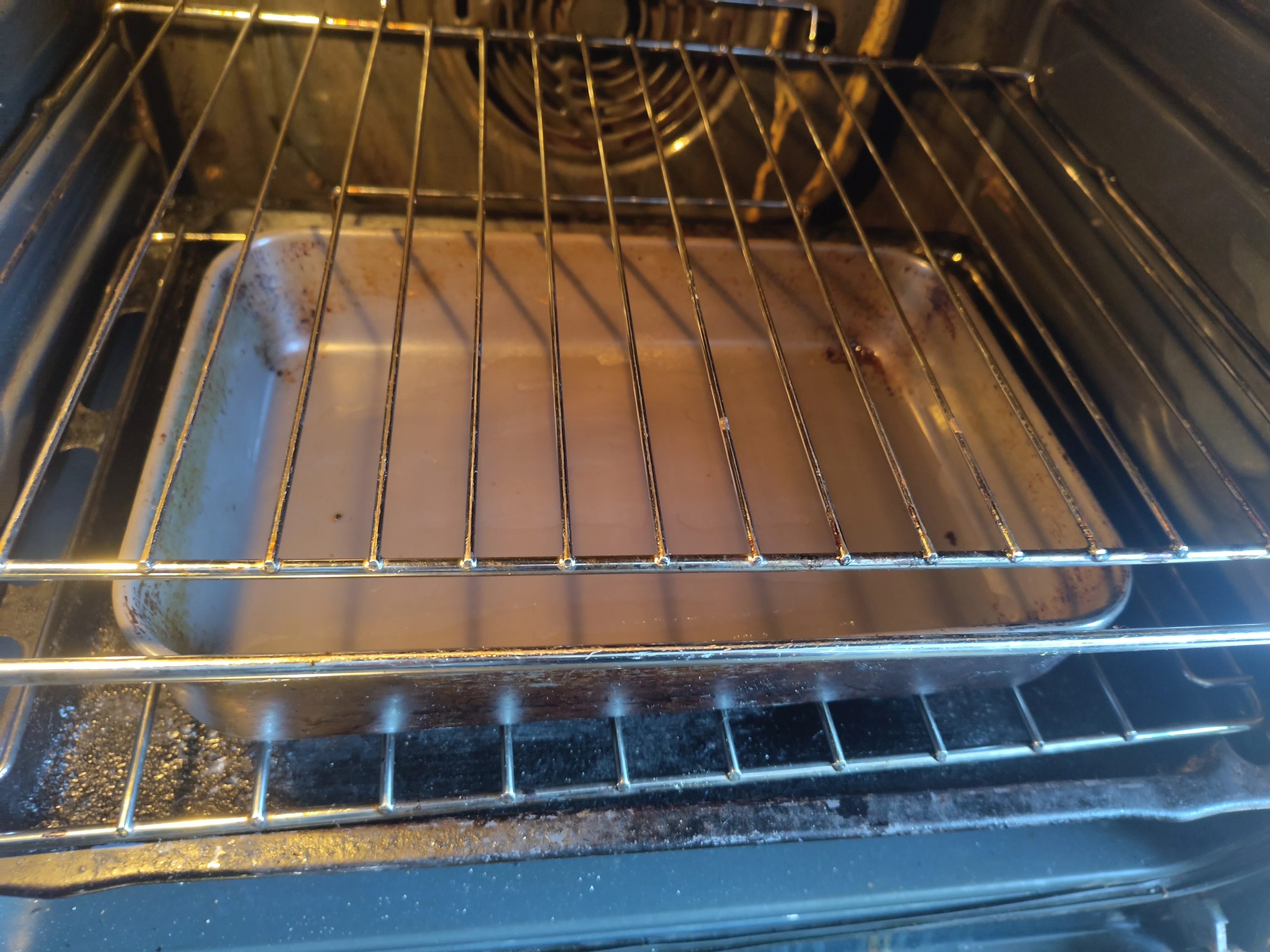 Oil in a pan, placed in an oven