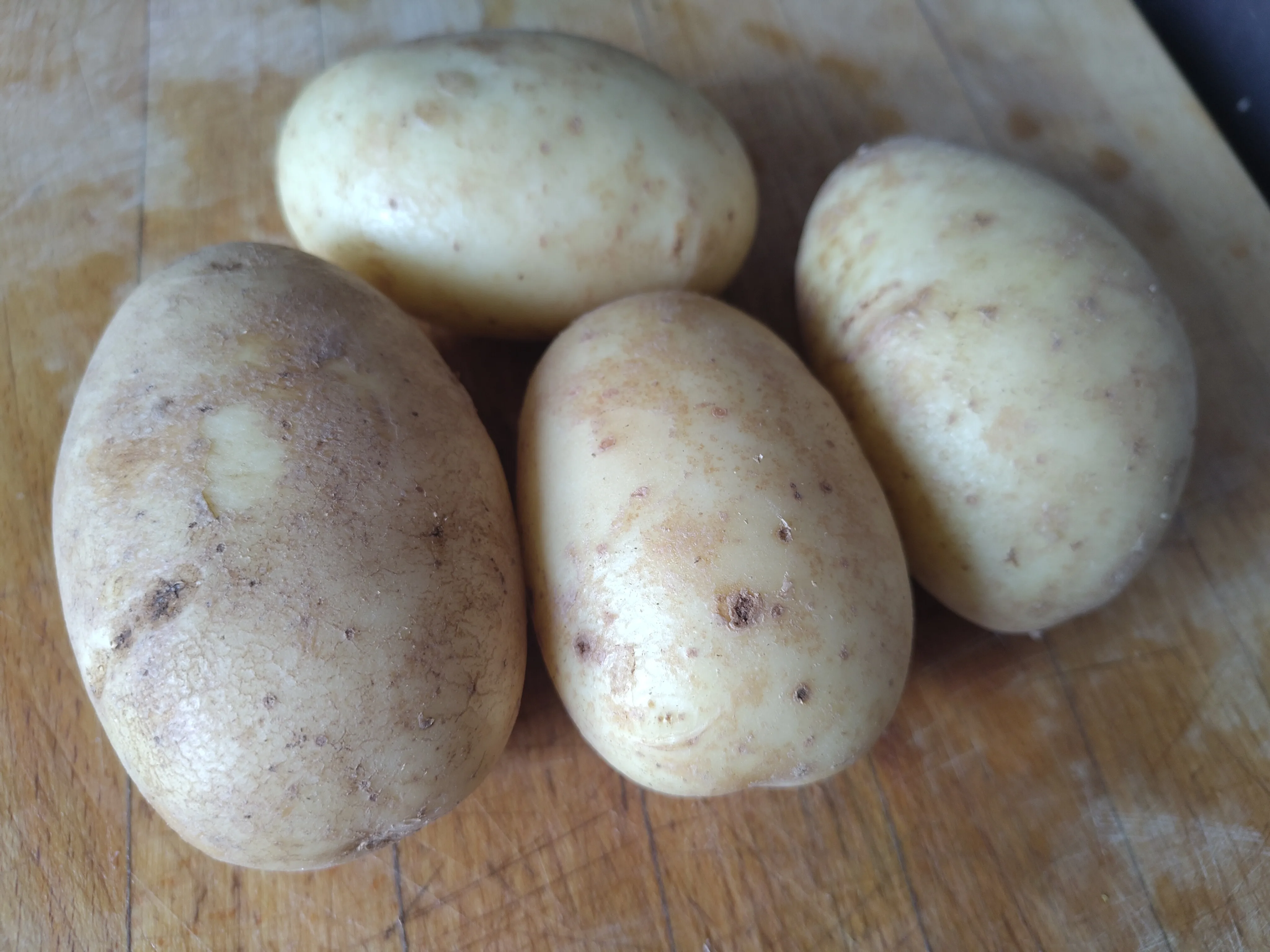 Potatoes on a chopping board