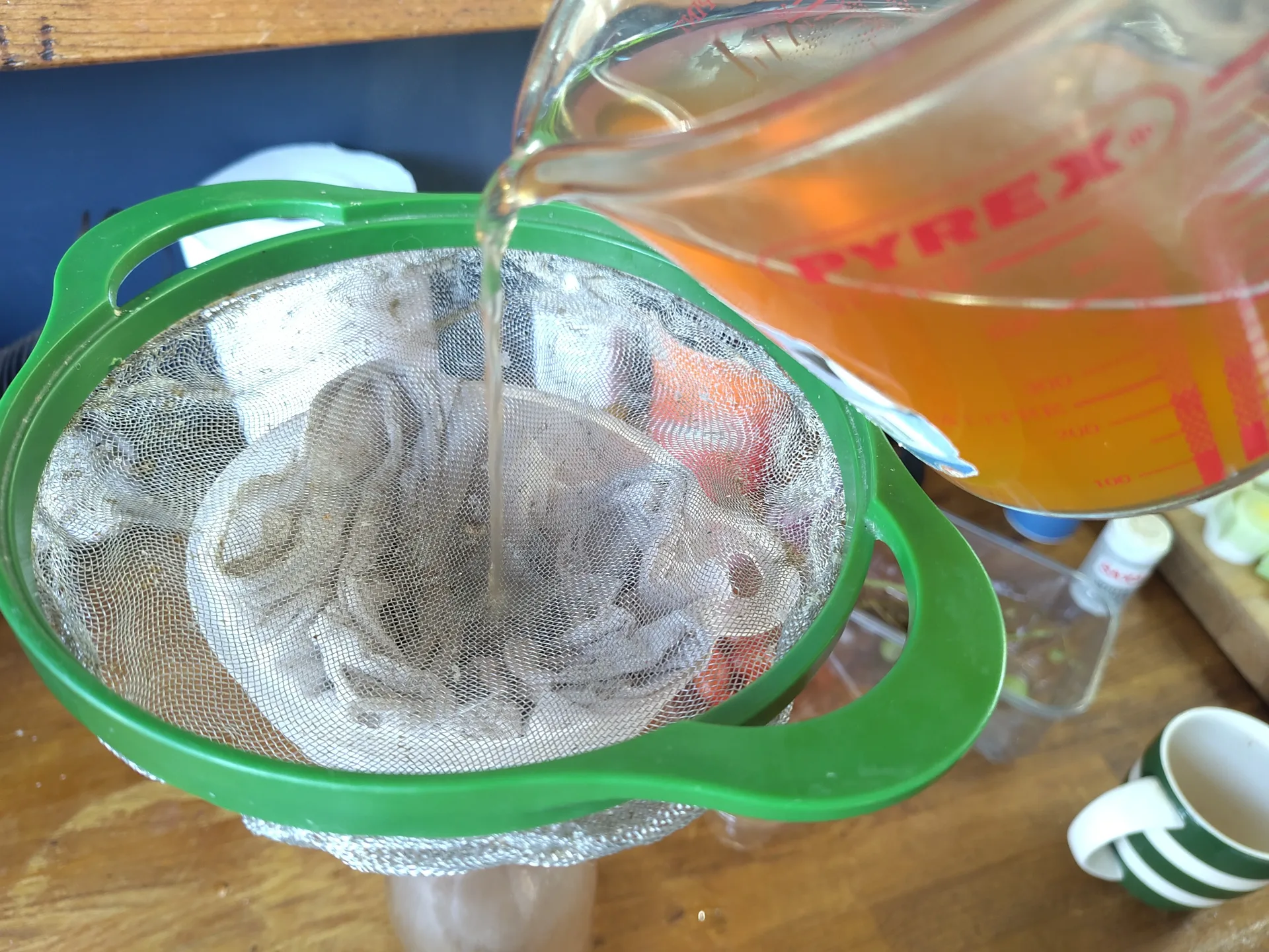 Pouring stock through a sieve