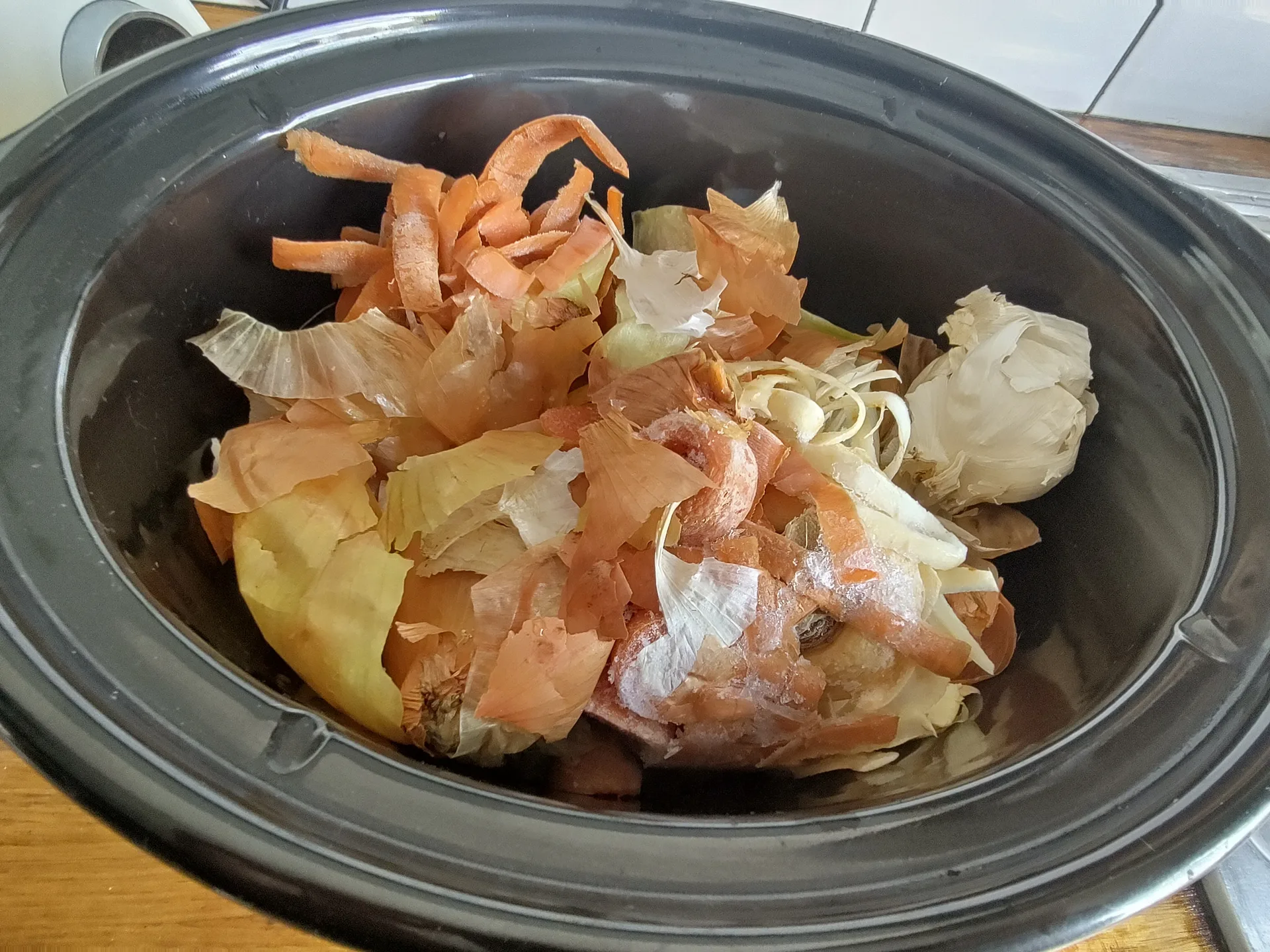 Vegetable trimmings in a slow cooker